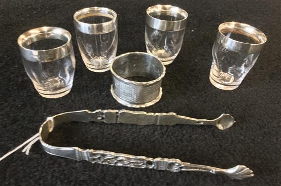 4 silver mounted glass tots, pair George III silver tongs and a silver napkin ring